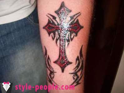 Cross tattoo on his arm. its value
